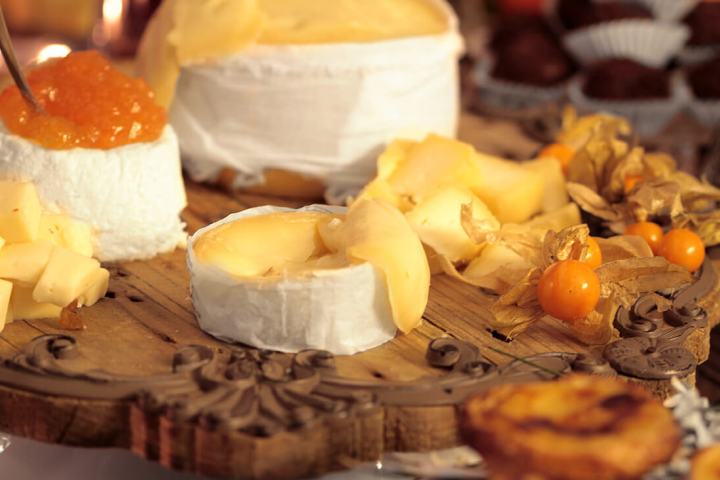 a board with cheese and tapas in Portugal