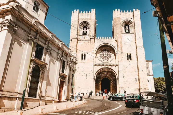 a view of a monument in a street of Lisbon
