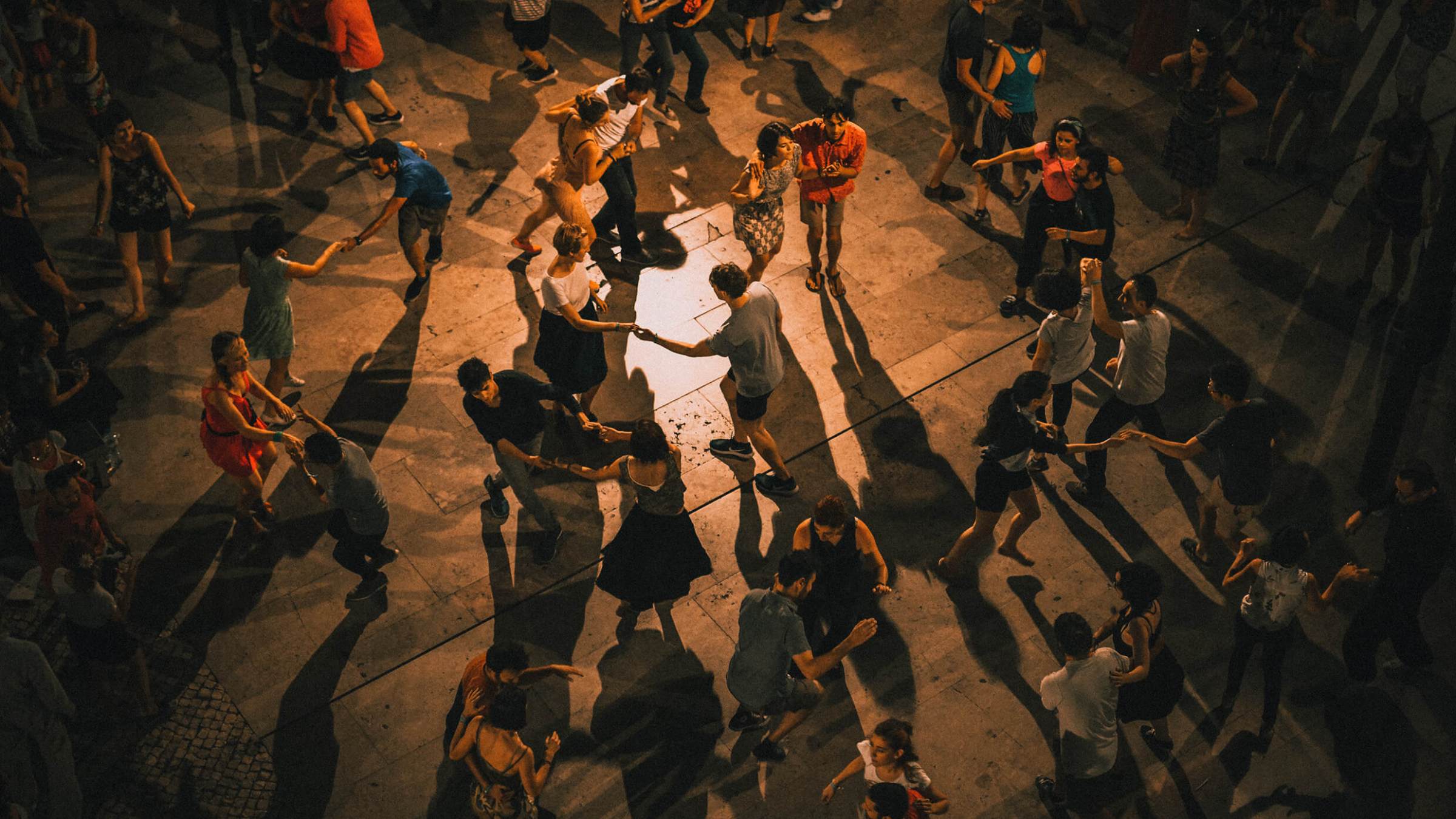 A group of people dancing in the night in Lisbon