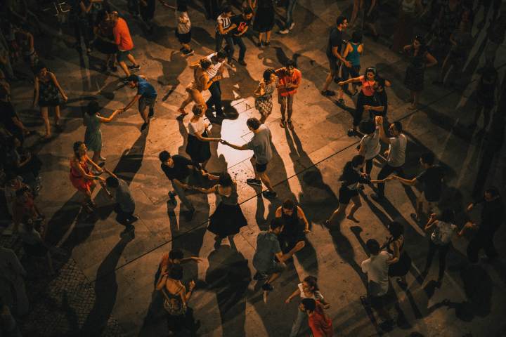 A group of people dancing in the night in Lisbon