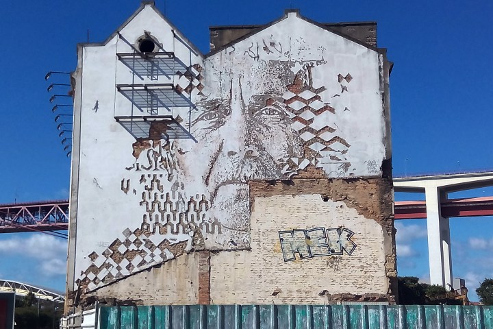 Portrait street art on a building in Lisbon